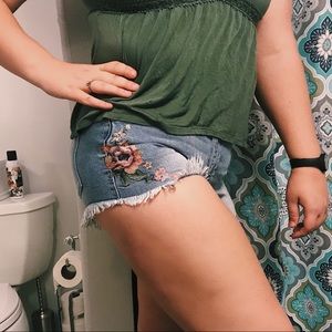 denim cutoff shorts with flower design